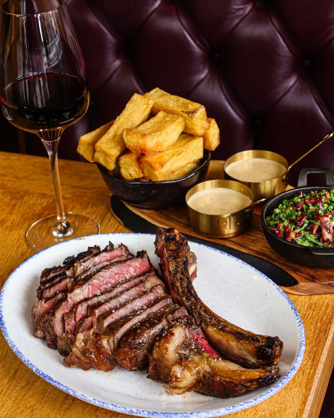 36oz côte de bœuf, carved, with wagyu chips and red wine