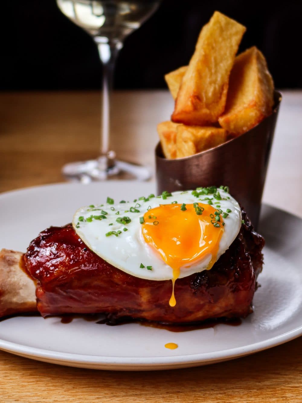 Glazed ham with a fried egg, wagyu fat chips and pineapple ketchup